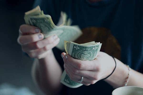 USA dollars in hands being counted