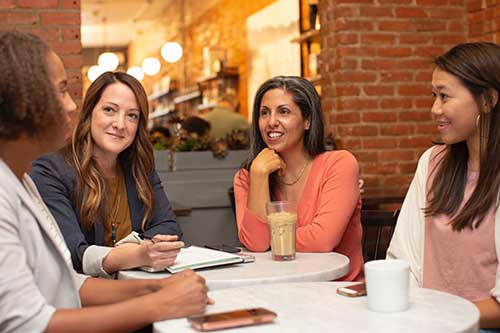 Group of ladies sitting around a table